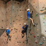 Blue campers working the climbing wall